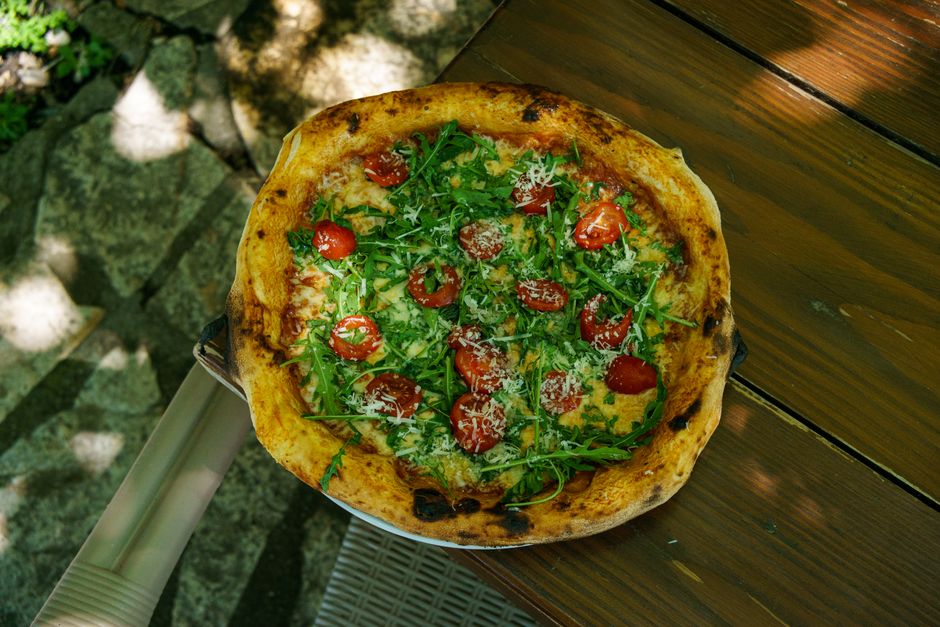Portable insulated pizza oven on a garden table